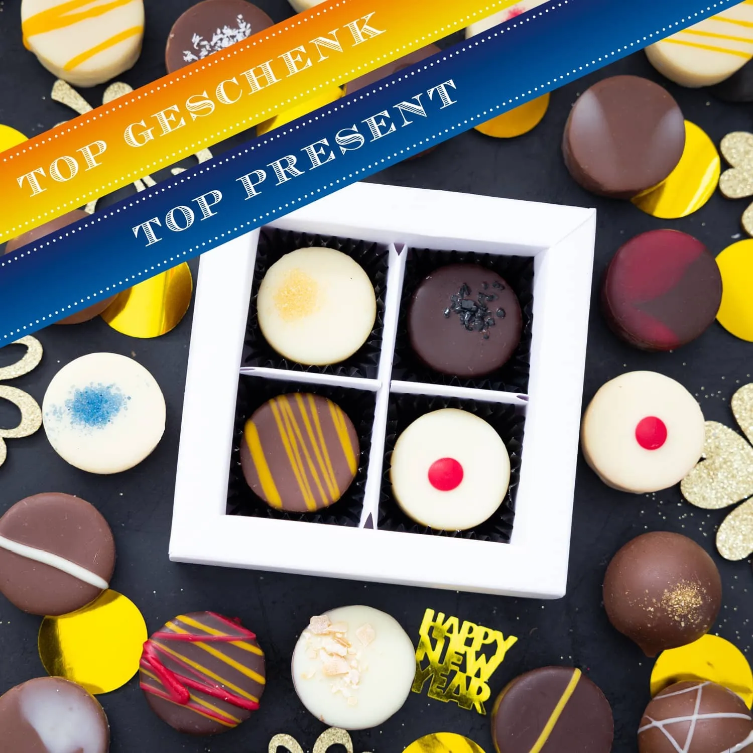 HANDWERK STATT MASSENWARE - Edition \Happy New Year\: Vergiss billig produzierte Standard-Pralinen mit schöner Verpackung - entscheidend ist nicht nur der erste Eindruck, sondern der Geschmack, der noch lange in Erinnerung bleibt